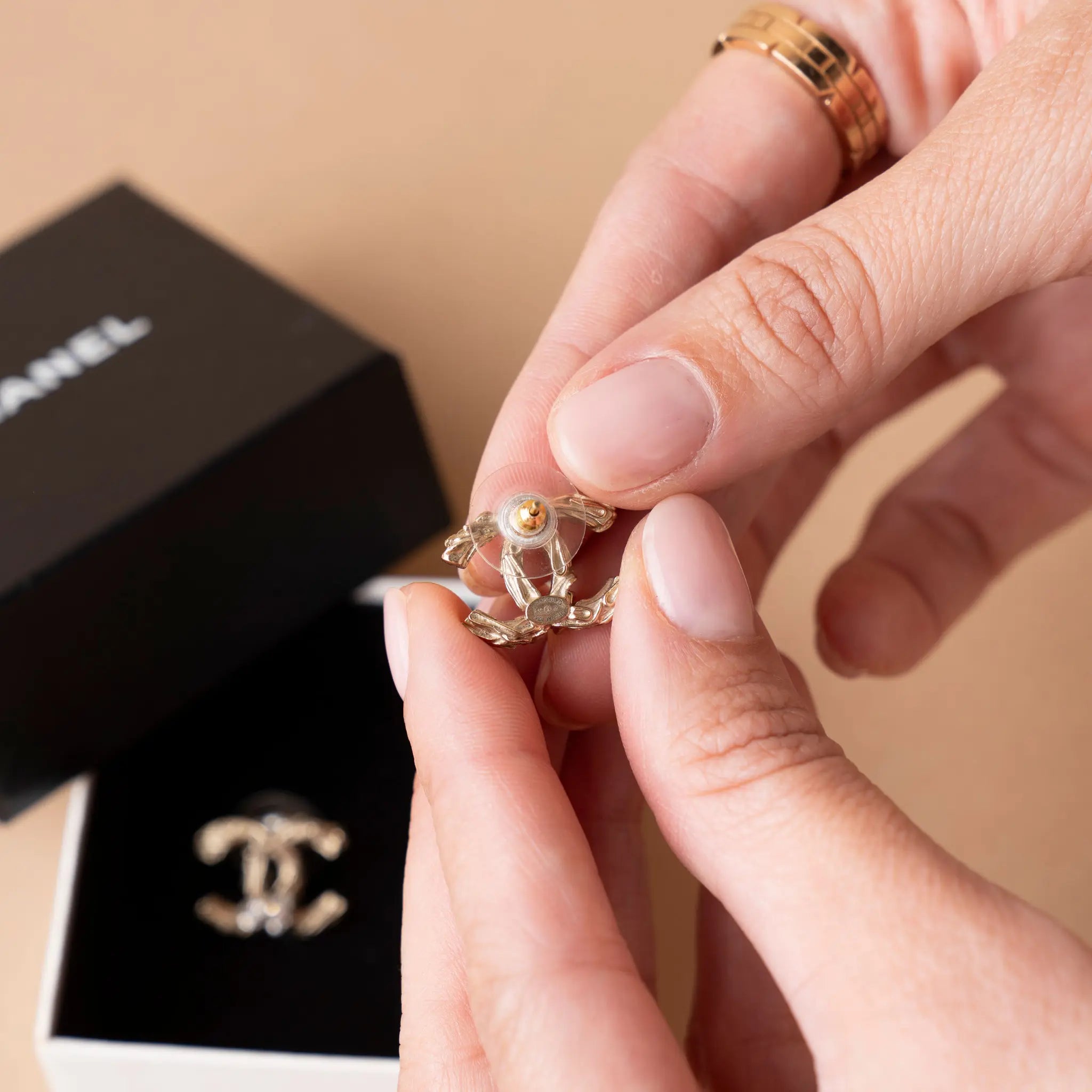 Chanel CC Brass and Strass Push Back Earrings — Side Profile