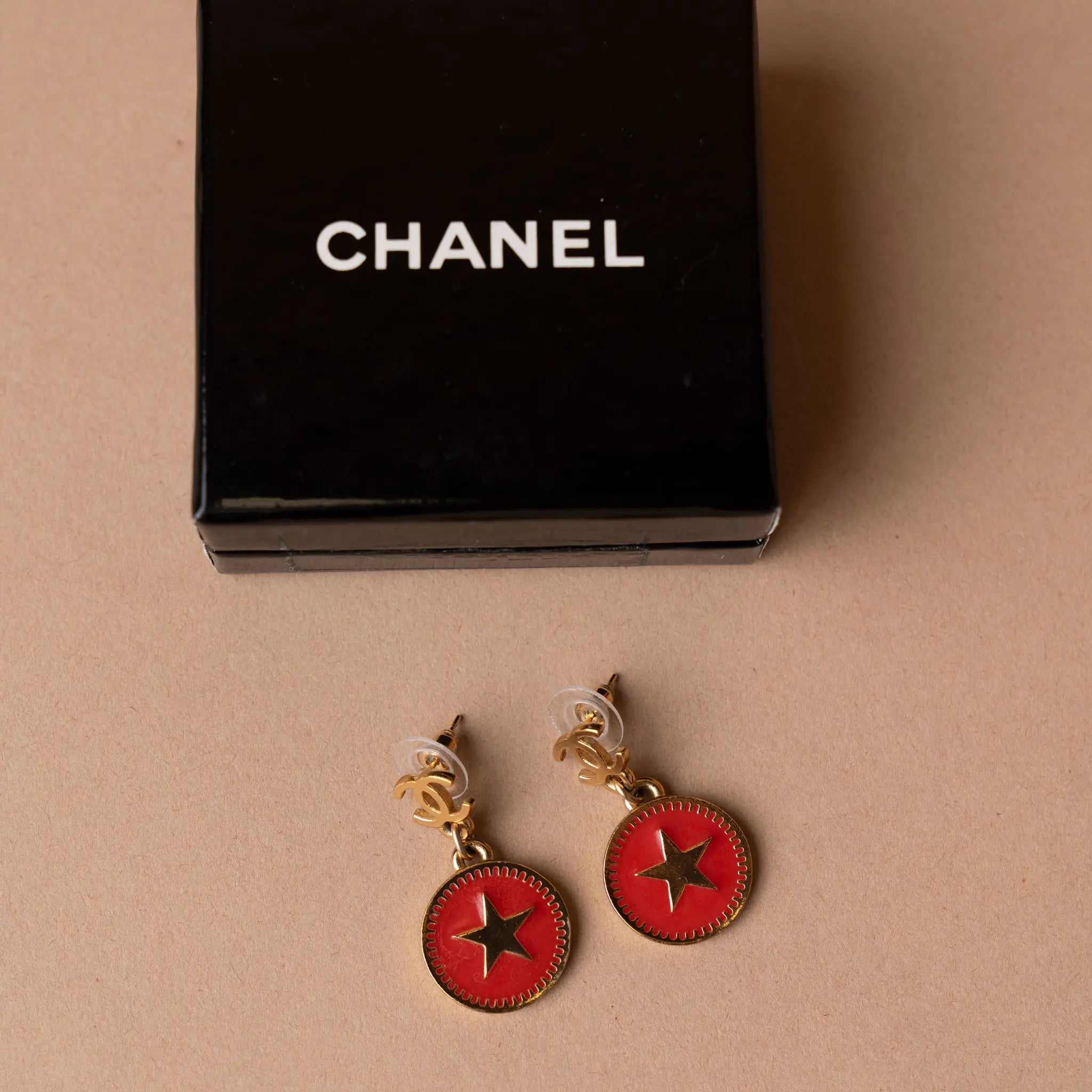 Chanel CC Gold Plated Enamel Star Dangling Push Back Earrings — Front View