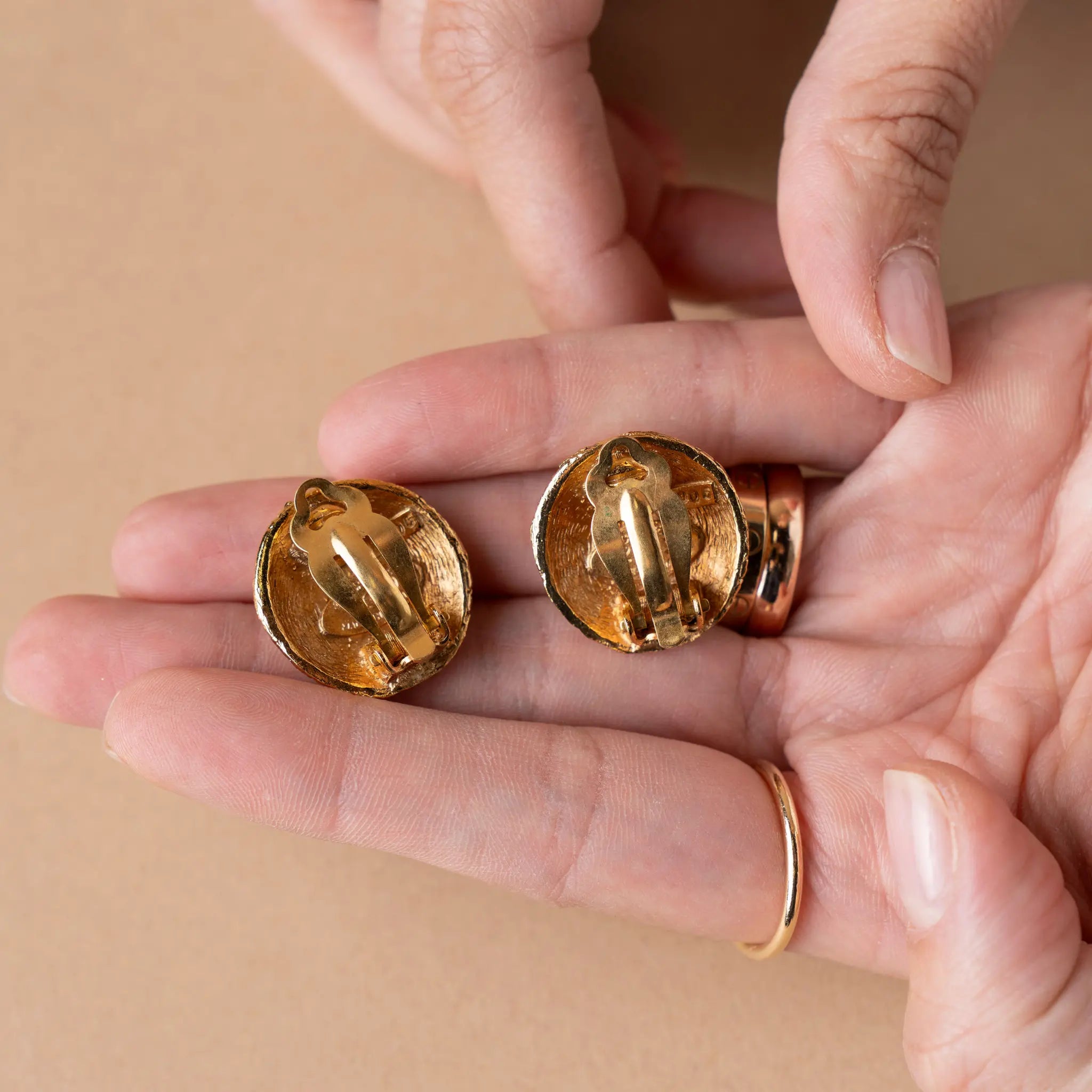 Chanel CC Gold Plated Textured Round Clip On Earrings — Front View