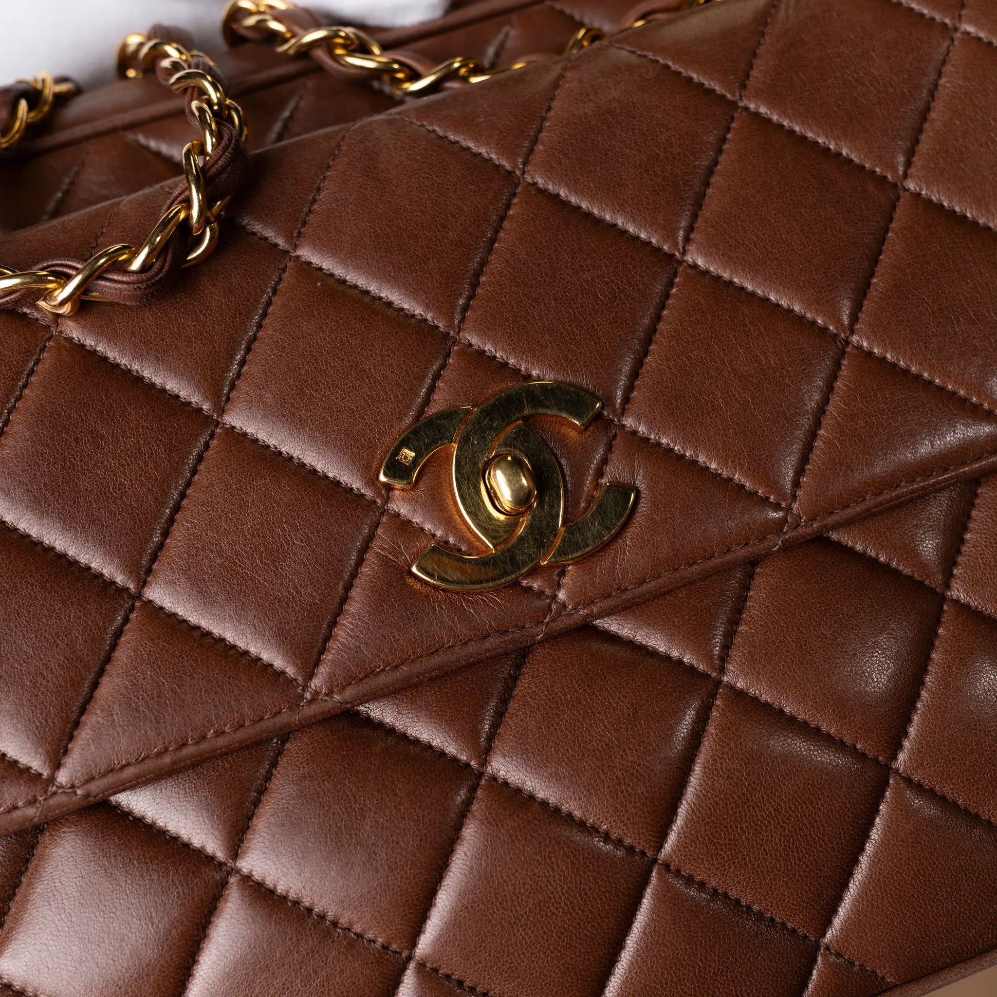 Chanel CC Quilted Lambskin Front Pocket Shoulder Bag — Close-up Detail