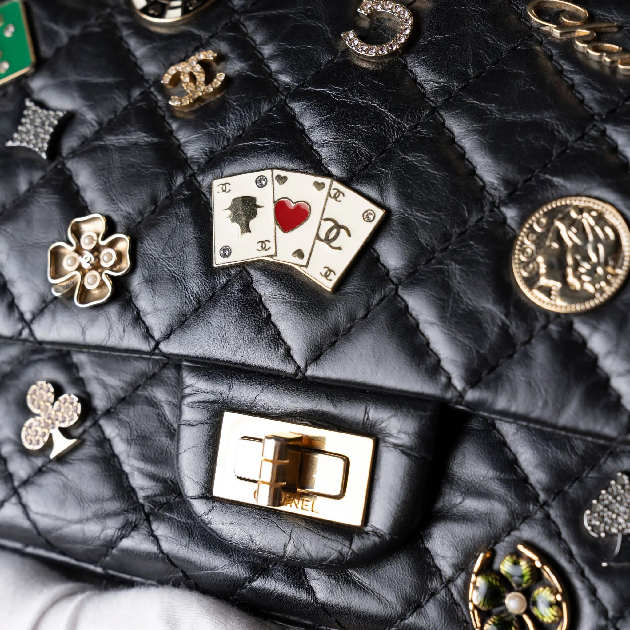 Chanel Quilted Aged Calfskin Reissue 2.55 Lucky Charms Double Flap 225 — Close-up Detail